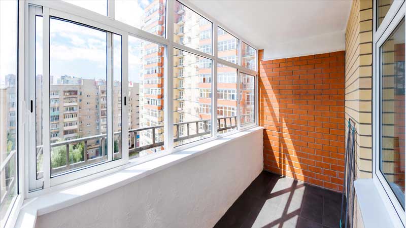 An interior view of a room with sliding windows.